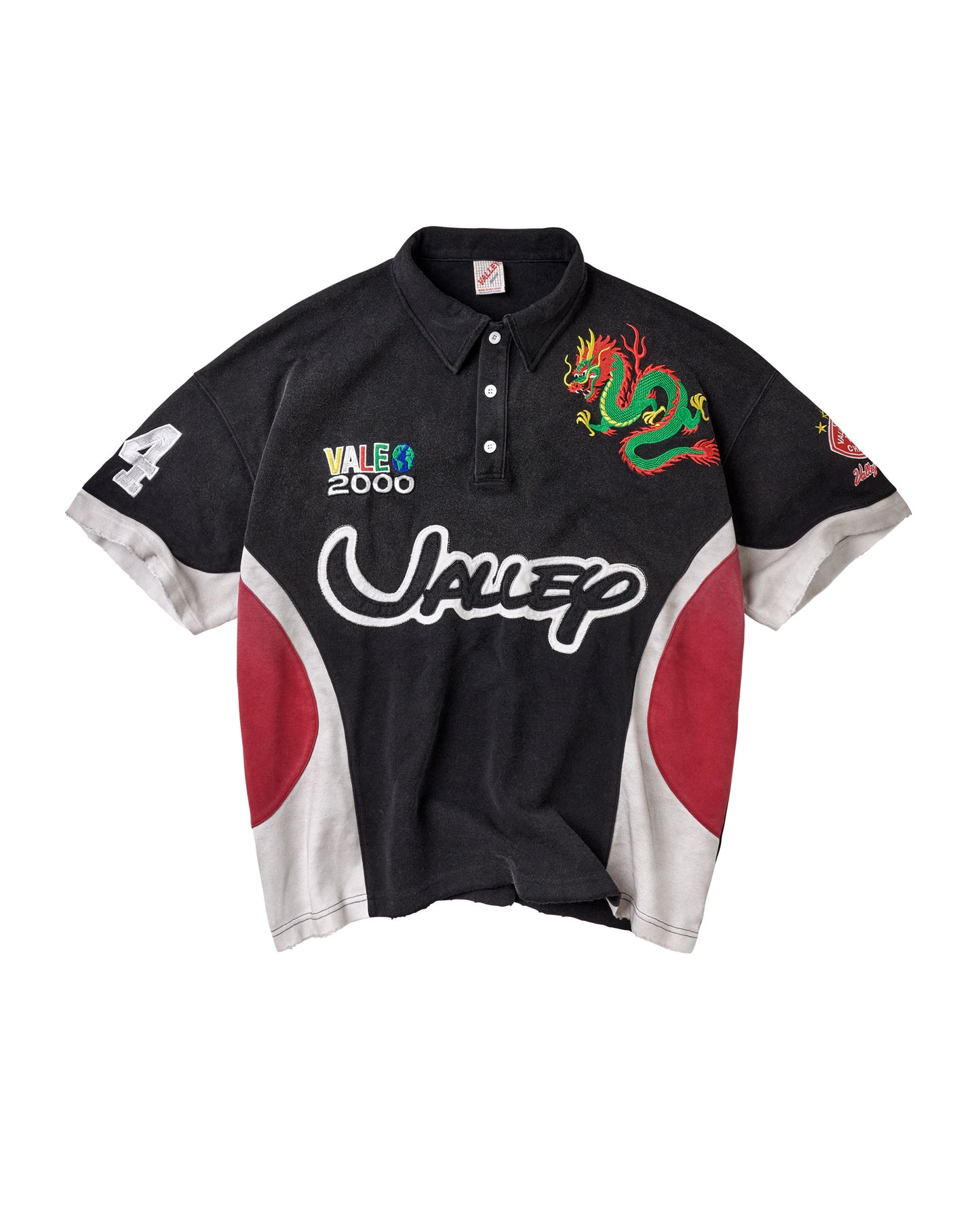 A black short-sleeve polo shirt with red and white side panels, featuring a green dragon graphic on the right chest, a white stylized 'Valley' logo across the front, and a 'Vale 2000' graphic on the left chest.